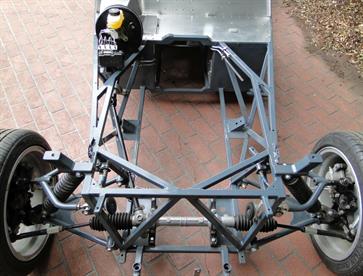 This photo shows the chassis design around the engine bay and front suspension with the additional triangulation and bracing that was added for rigidity.