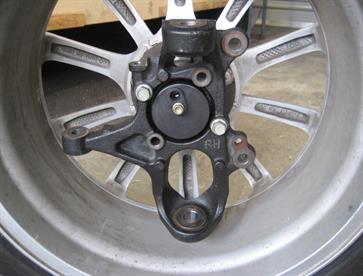 Standard MX5 upright fitted to original MX5 wheel.  The round fitting in the centre of the upright is the ABS sensor.  Wheel is 7x17 and upright is deeply offset into wheel which provides improved handling over the ancient Cortina set up commonly used in Locost construction.